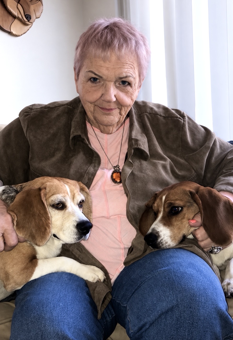 Grandma in her natural habitat, surrounded by beagles.