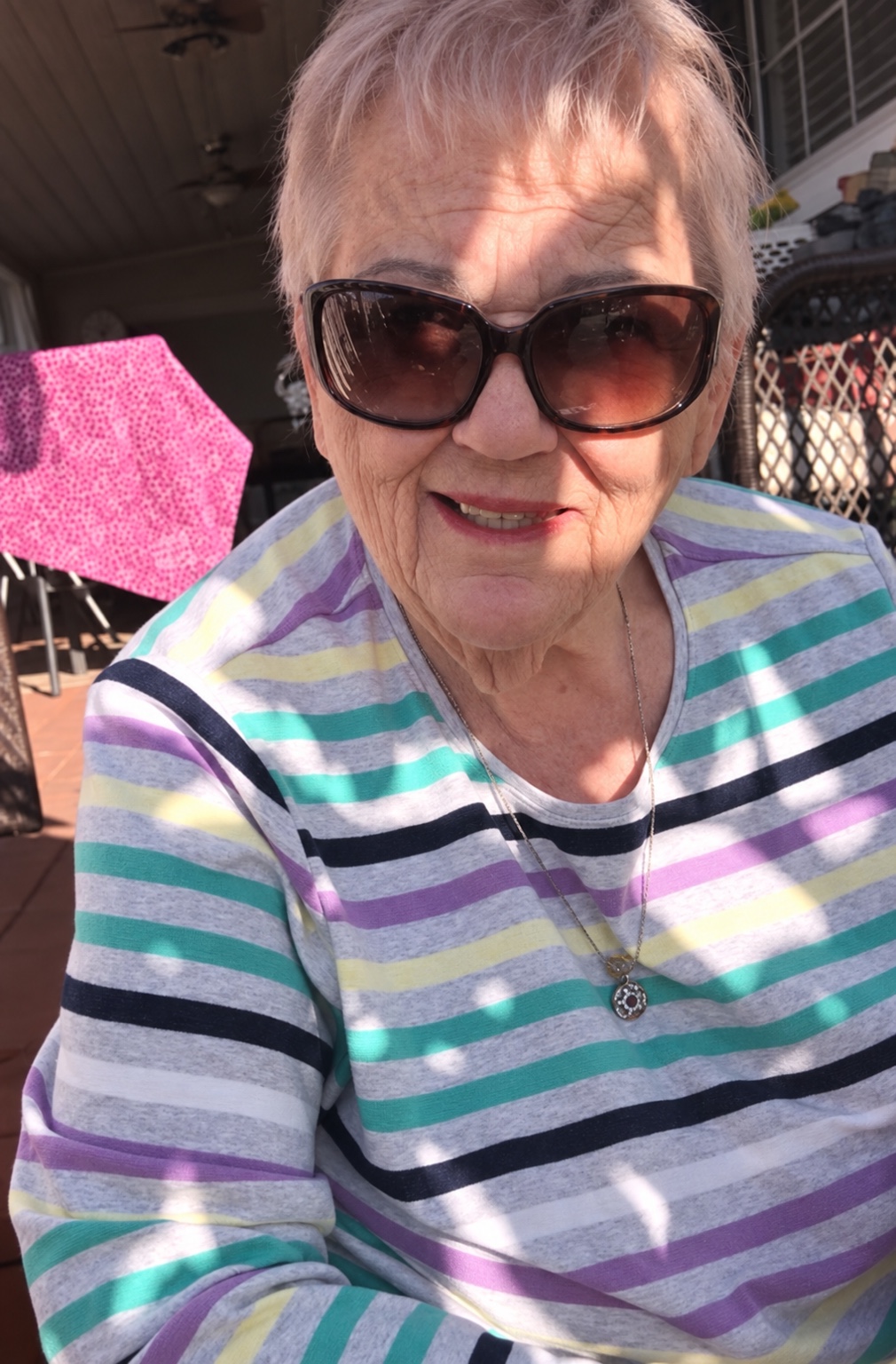 Grandma posted up on the porch looking cooler than all of us.