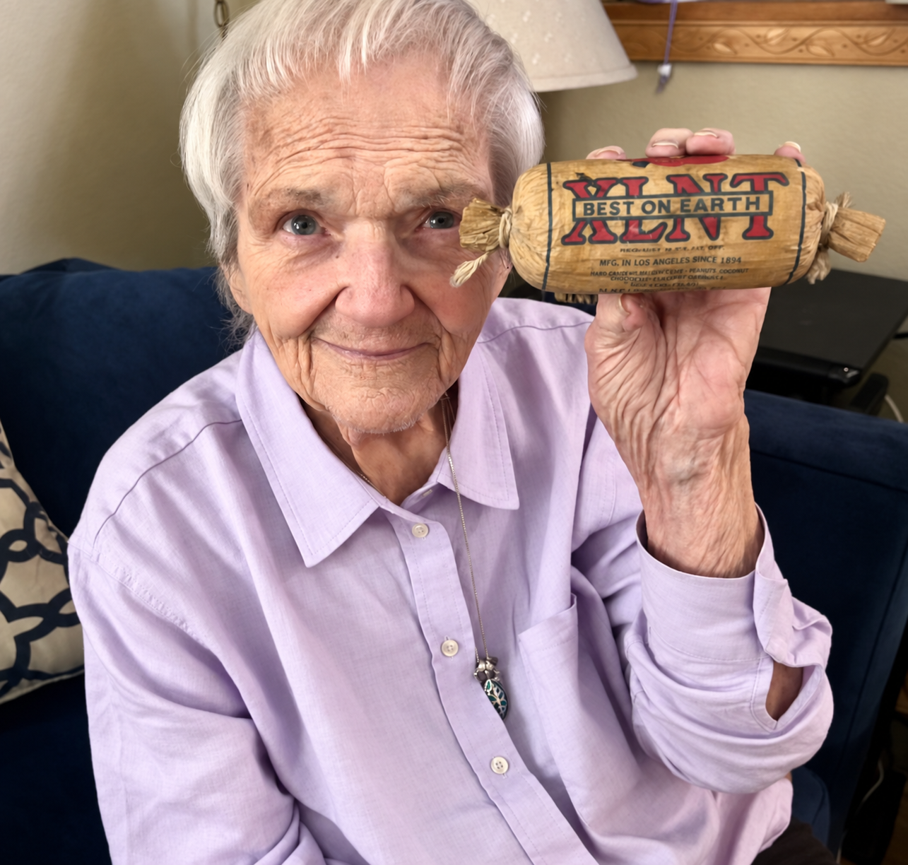 Judith proudly showing off the almost perfectly preserved XLNT tamale, saved from the days when her dad, Herman, worked as a tamale truck driver.